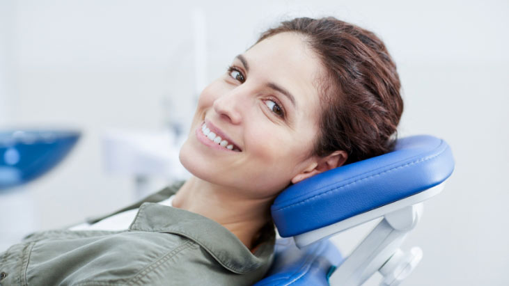 Lady-in-Dentist-Chair-Welcoming-Patients